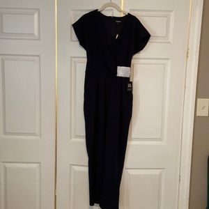 Express jumpsuit. Navy. Size small. Wrap front with pockets.